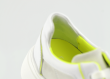 Ladies' sports shoes in white and electric green Thumb