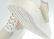 Ladies' sports shoes in white and orange colours Thumb